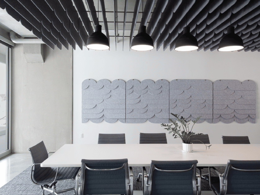 Loftwall tempo panels hung on ceiling and wall of modern conference room