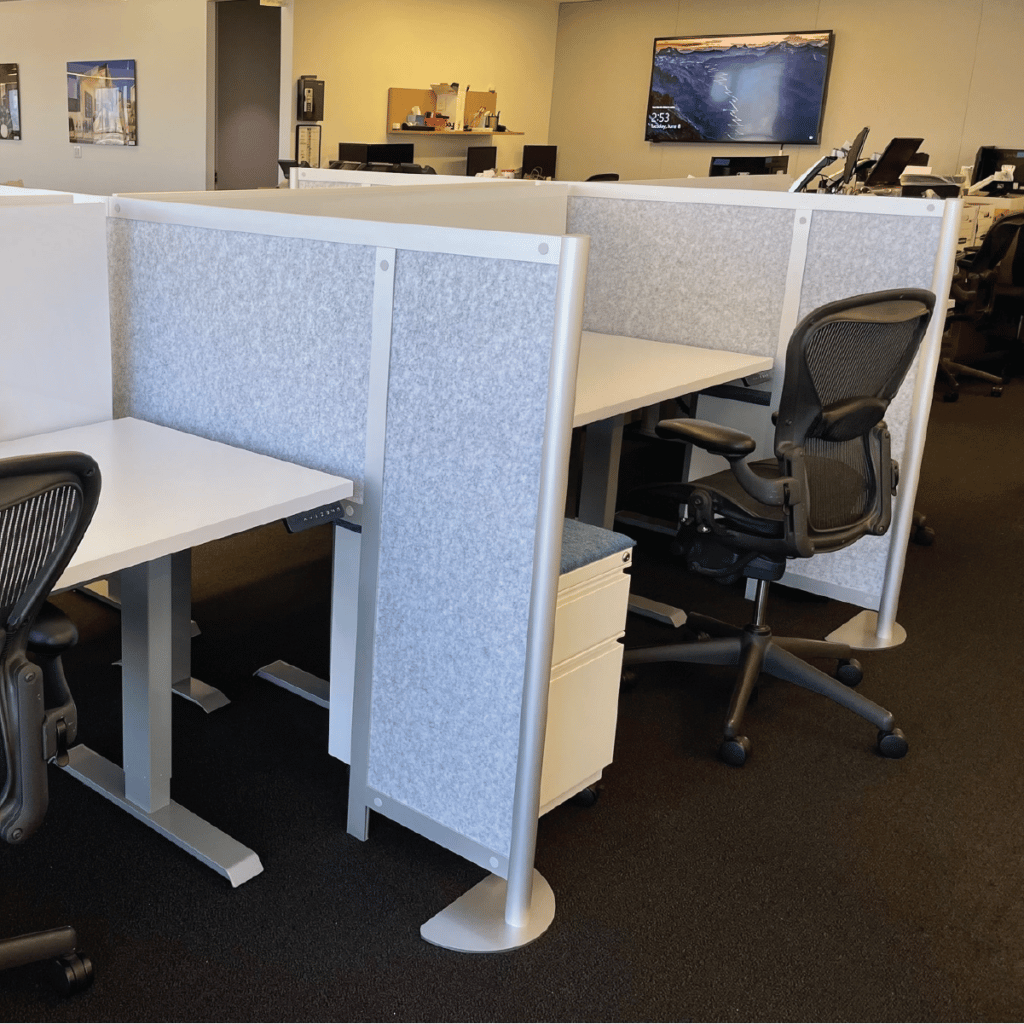 Loftwall acoustic felt panels in double hitch desk divider spanning two desks in new office install