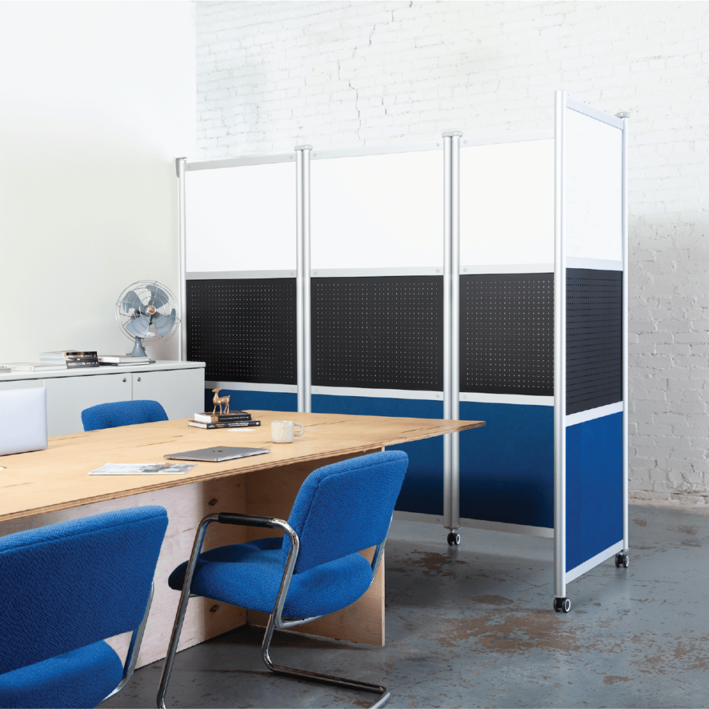 Loftwall collapsible Pivot room divider bent around a conference room table with blue chairs
