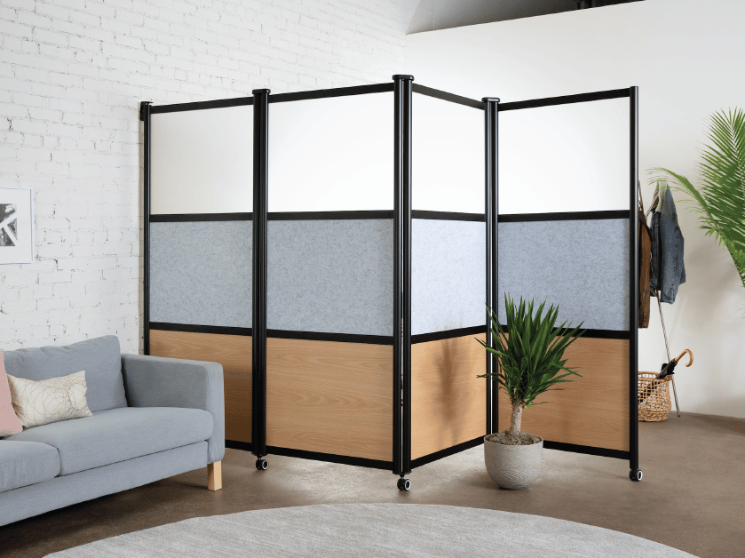 Loftwall wall mounted Pivot room divider folding around plant and couch