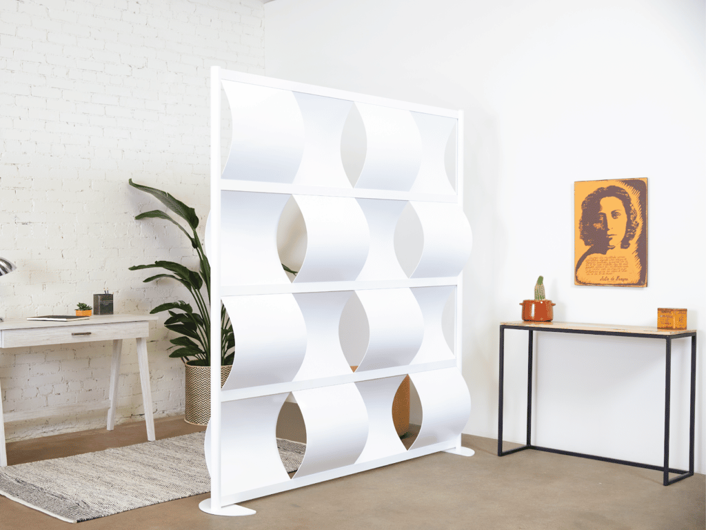 Loftwall Wave wall partition set up in modern home with plant and art work around white divider