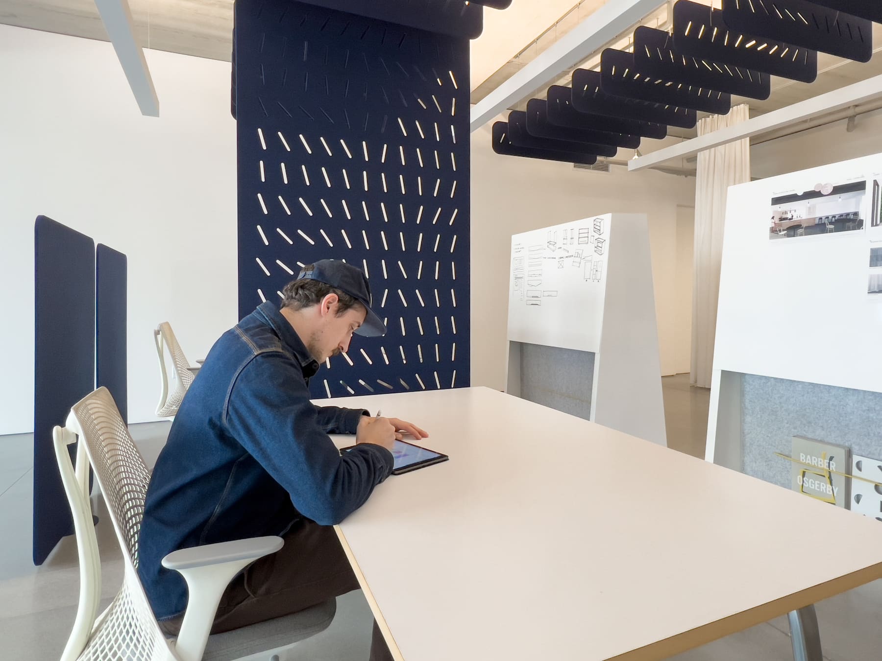 Buffer room divider, Gravity hanging screen, and Sky ceiling baffles in modern office space