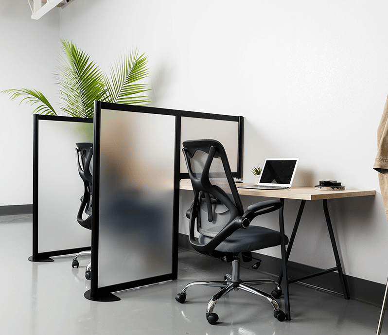 Office desk divider shown with frosted acrylic panels